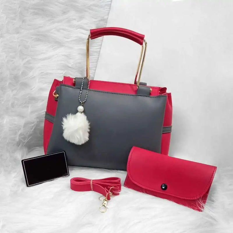 Red and gray handbag with matching pouch on a textured white surface online sale in Pakistan
