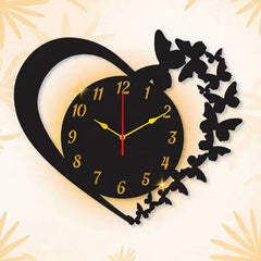 Heart-shaped wall clock with butterfly designs on a light background
