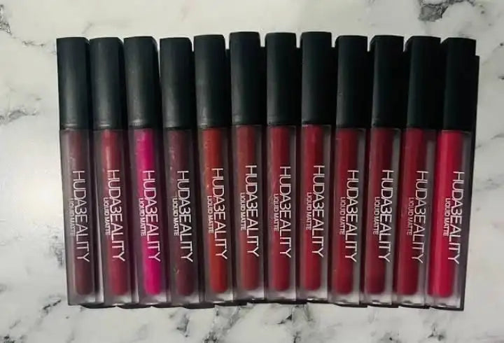 Row of Huda Beauty lipsticks on a marble surface online sale in Pakistan