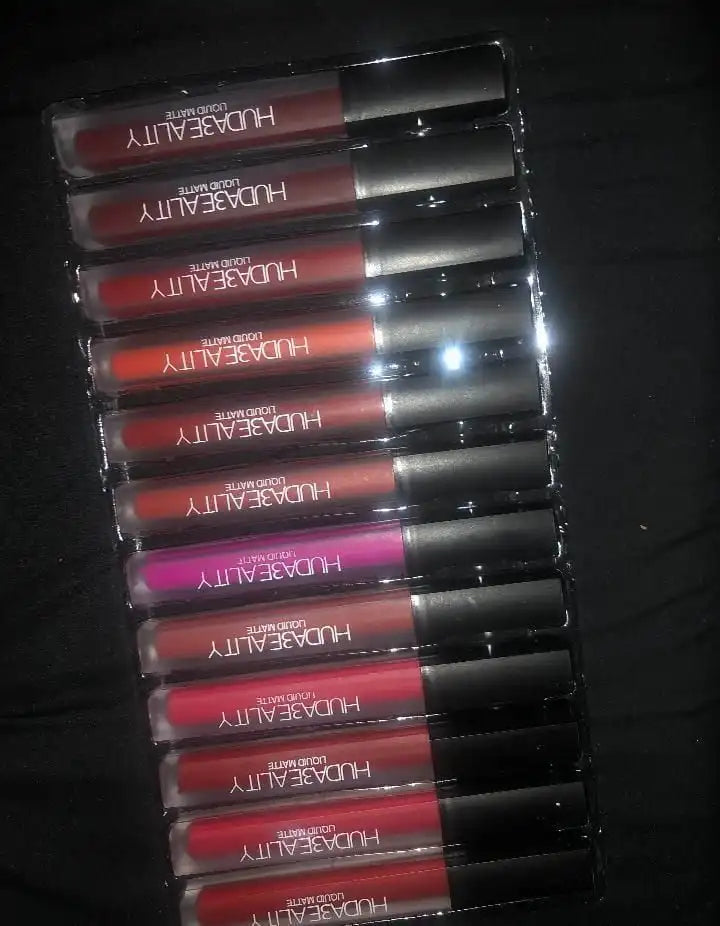 Set of Huda Beauty lipsticks in various shades on a dark background online sale in Pakistan