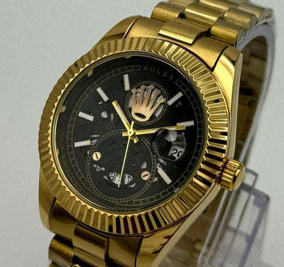 Gold watch with black face on a light gray background